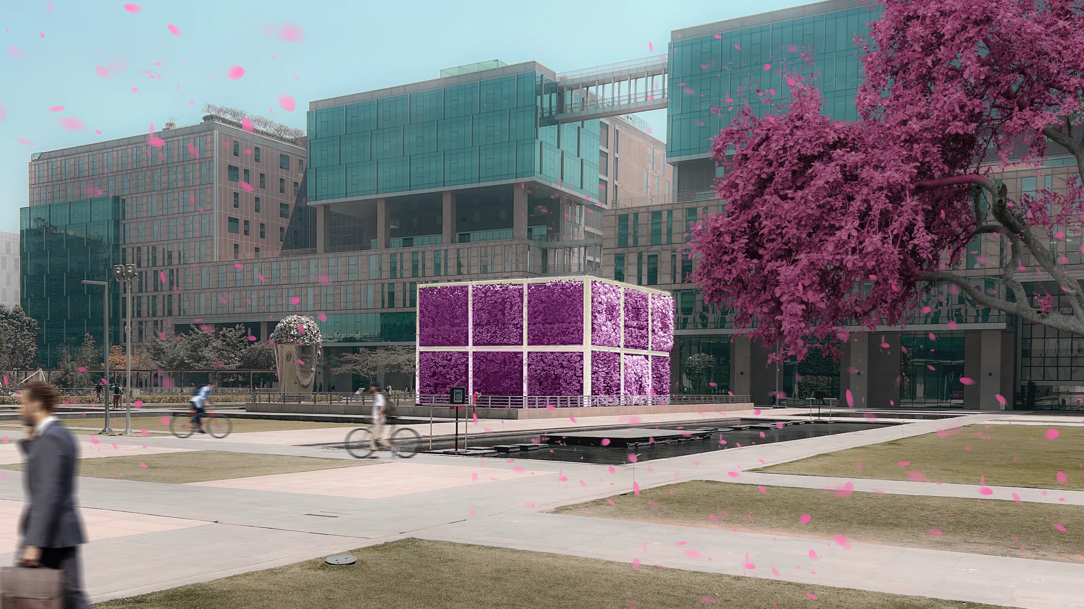 The realized green cube set in the tech-park campus, its planted faces in bloom