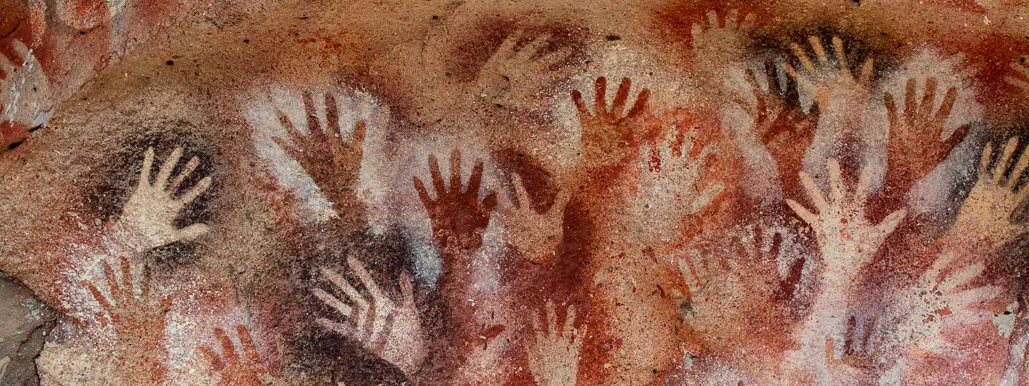 Hand stencils on the rock wall of the Cueva de las Manos