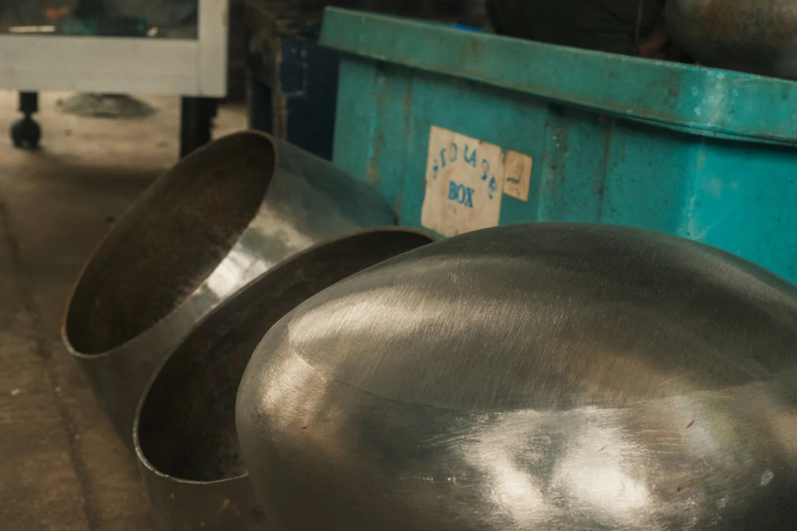 An unfinished steel alms bowl