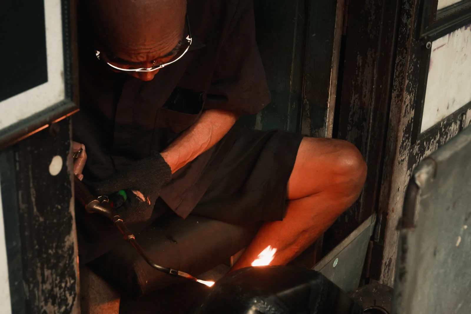 Soldering an alms bowl over an open flame