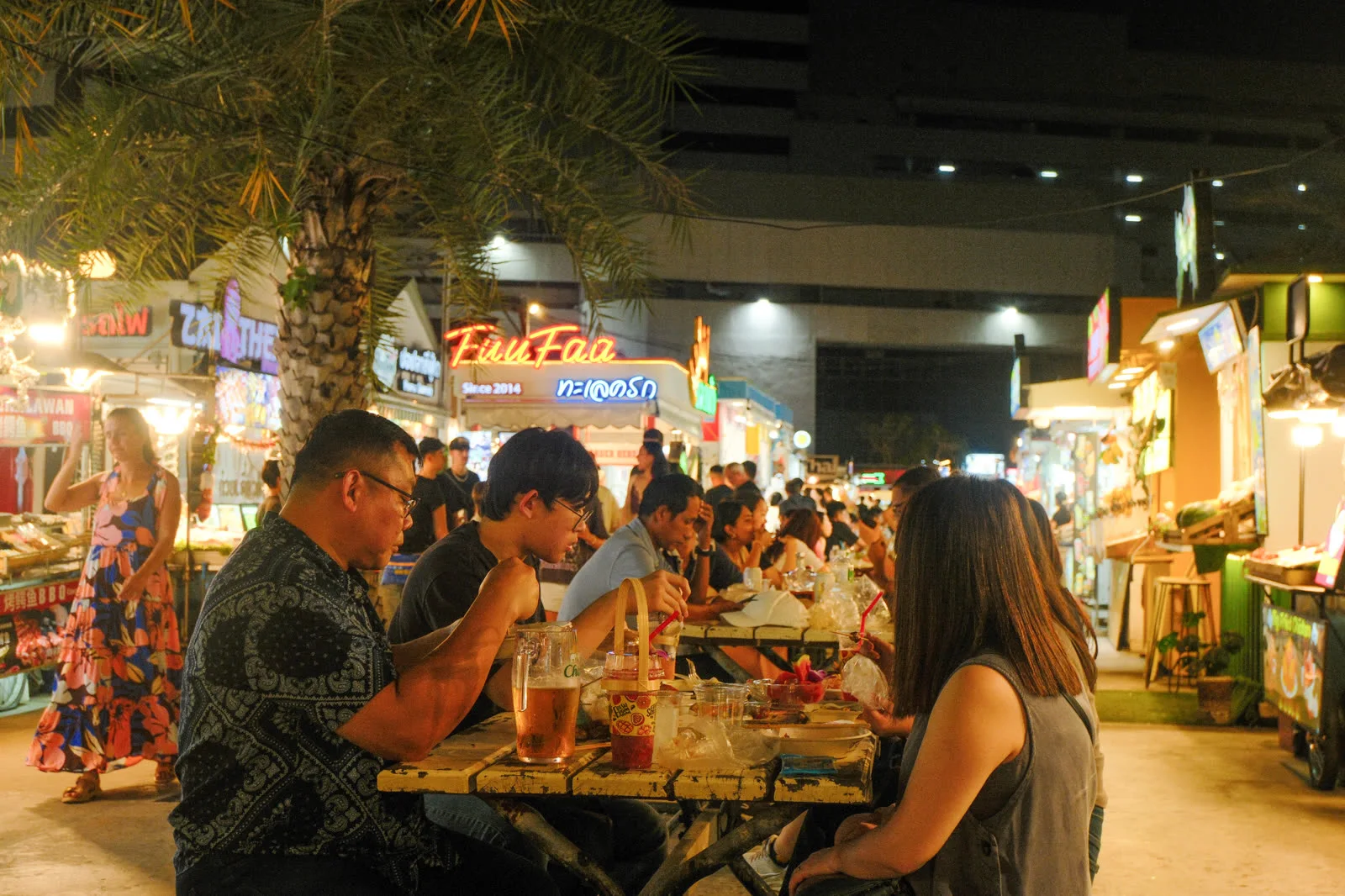 Busy street food stalls after dark